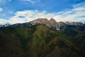 Naklejka premium Aerial view of Giewont summit in Tatra mountains. Panoramic landscape with mountain ranges against morning sky. Travel tourism concept