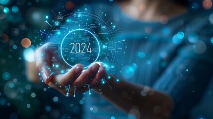 Hand holding virtual digital icon of number "2024" with technology background.