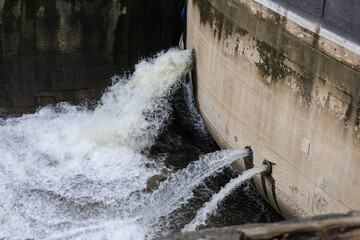 Steel gates dumping water into the dry dock in Bristol city