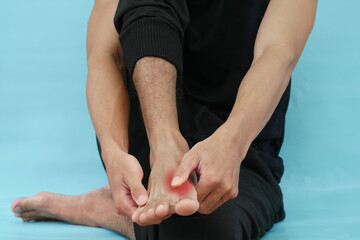 Human hand holding a sore leg, joint pain, gout, leg pain, soreness and injury.
