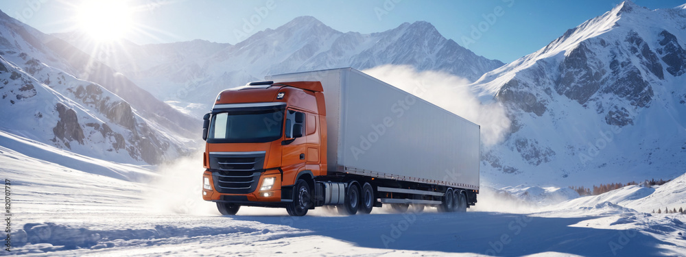 Wall mural a truck with a trailer is driving along a snowy road at dawn high in the mountains. logistics and in