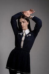Portrait of attractive caucasian young brunette woman in school uniform in studio. Elegant woman posing. Pretty stylish model. Beauty, Style, Fashion, Luxury