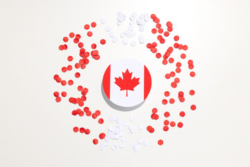 Maple leaf with decorations on a light background