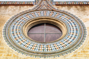 The window of a convent. Close up of a monastery facade.