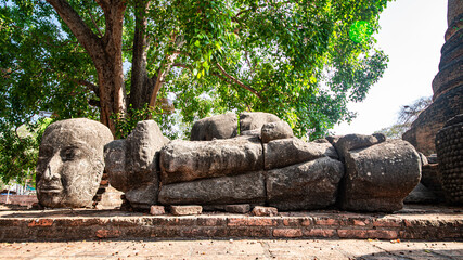 Ruins of the Chedi Stupa Church And an ancient Buddha image from the Ayutthaya period is in Wat Ratchaburana, an old temple over six hundred years old, Ayutthaya, Thailand.