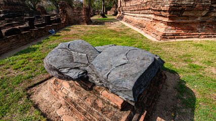 Ruins of the Chedi Stupa Church And an ancient Buddha image from the Ayutthaya period is in Wat Ratchaburana, an old temple over six hundred years old, Ayutthaya, Thailand.