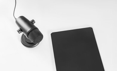black microphone and tablet on the table