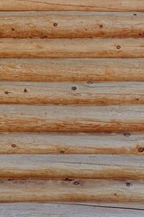 Closeup of exterior wall detail of a log building.