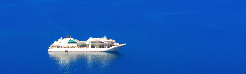 Seascape banner of cruise passenger ship and blue sea, ocean. Luxury cruise travel concept.