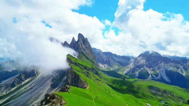 View from above, stunning aerial view of the mountain range of Seceda during a cloudy day