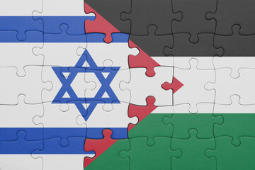 puzzle with the colourful national flag of israel and flag of palestine .