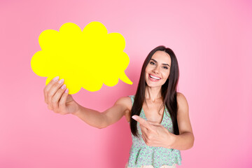 Photo of cute lovely pretty woman wear stylish clothes hold card empty space isolated on pink color background