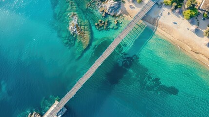 An aerial view of a tropical island showcasing a dock extending into the aqua water leading to a...