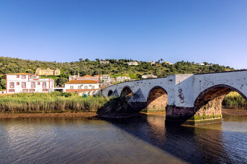 Ancient Roman bridge over Arade River in Silves, Algarve Portugal