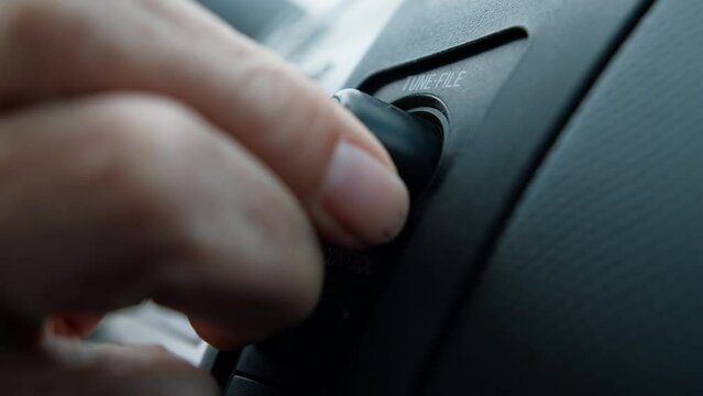 Hands Raising Up The Volume In The Car 