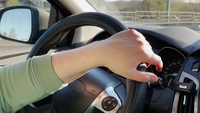 close-up of the steering wheel. make a turn. man in the car. slow motion video. High-quality 4K shooting