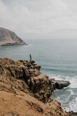 A serene expanse of the ocean with a majestic snow covered mountain in the background