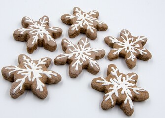 Delicious array of gingerbread snowflake cookies arranged on a neat white surface