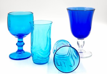 Closeup of blue diverse glasses on a white background