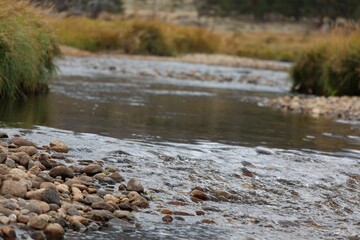 Tranquil river flowing through a rocky valley