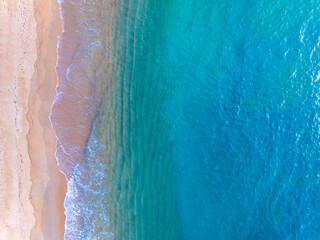 Amazing Top view sea beach landscape background,Summer sea waves crashing on sandy shore seascape background,High angle view ocean nature background