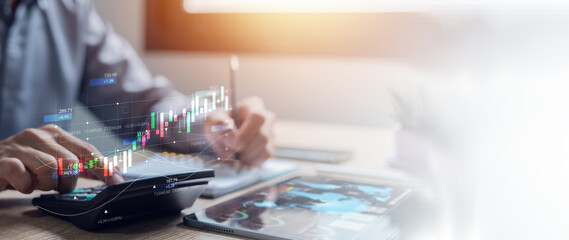 Businessman uses a calculator to calculate financial reports. data analysis growth graph Strategy...