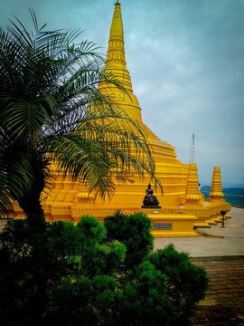 Vertical shot of a golden pagoda in Nelligala Temple, Sri Lanka