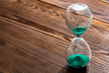 Turquoise sand hourglass to measure time	