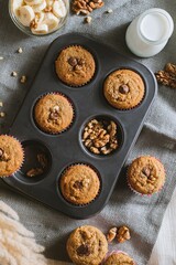 Tray of freshly-baked muffins sits on a table.