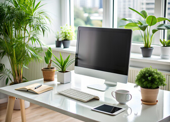 Perfect office white desk with a clean monitor and a smartphone plants on the background