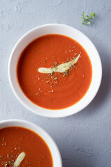 Delicious tomato soup with cheddar cheese	