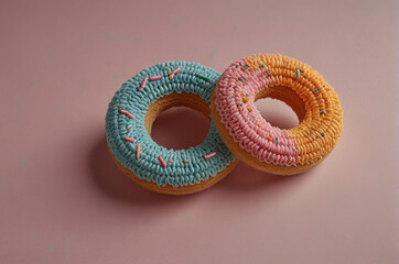 Crochet Amigurumi Donuts with Empty Space, Selective Focus - Perfect for use in creative projects, advertising, or as a whimsical decoration.