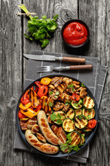 grilled white sausages with veggies and mushrooms