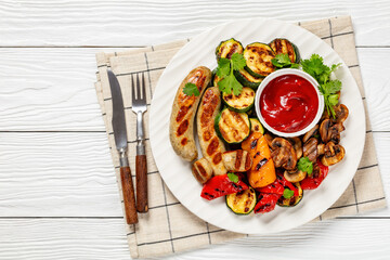 grilled white sausages with veggies and mushrooms