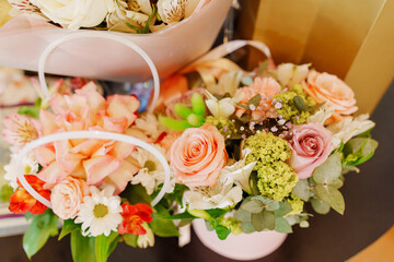 Large beautiful bouquets of different delicate flowers. A traditional gift for the holiday.