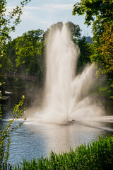 Fototapeta premium Water pressure fountain in summer in Riga, Latvia national park in city centre