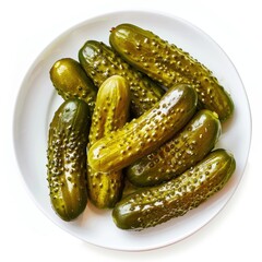 Glistening pickles on a white plate. Top view.