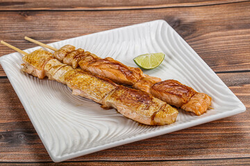 Grilled salmon skewer with sauce