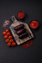 Delicious black blood sausage or black pudding with spices and herbs