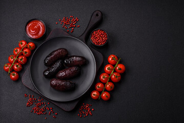 Delicious black blood sausage or black pudding with spices and herbs