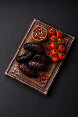 Delicious black blood sausage or black pudding with spices and herbs