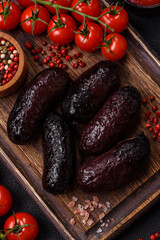 Delicious black blood sausage or black pudding with spices and herbs