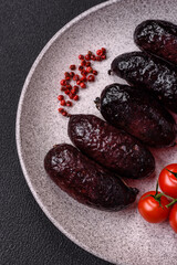Delicious black blood sausage or black pudding with spices and herbs