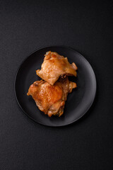 Delicious juicy chicken thighs baked on the grill with salt