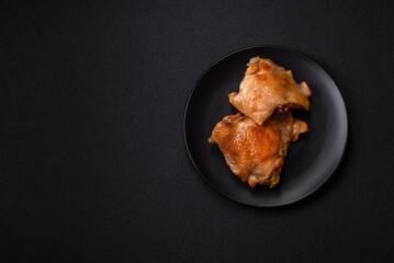 Delicious juicy chicken thighs baked on the grill with salt