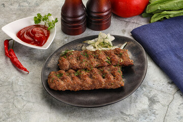 Kebab with beef served onion