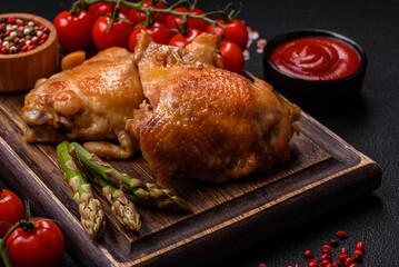 Delicious juicy chicken thighs baked on the grill with salt
