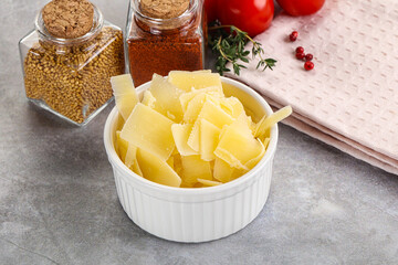 Sliced parmesan cheese in the bowl