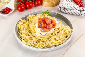 Pasta spaghetti with salmon and stracciatella