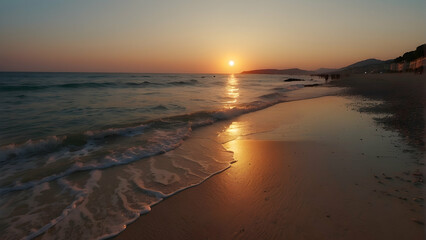 Serene beach scene at sunset with the sun kissing the horizon and gentle waves lapping the shore